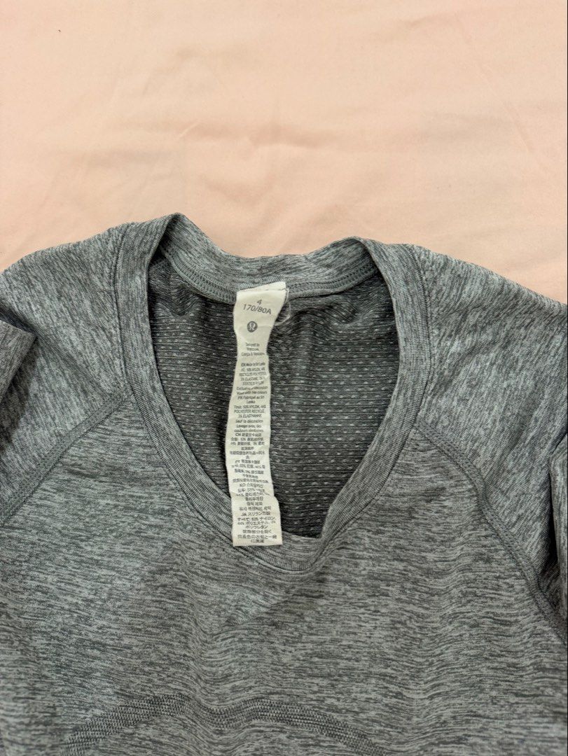 Lululemon Grey Heathered Seamless Long Sleeve Top (Category: Activewear) located in Tuguegarao City. Submitted by joysmithznjo (Listing ID 1461887835, Image 2). Description: - Lululemon grey heathered long sleeve top - Seamless knit fabric for comfort - Raglan sleeves for a sporty look - Cropped fit, stylish and modern - Versatile: great for workouts or casual wear - Brand new with tag still attached.