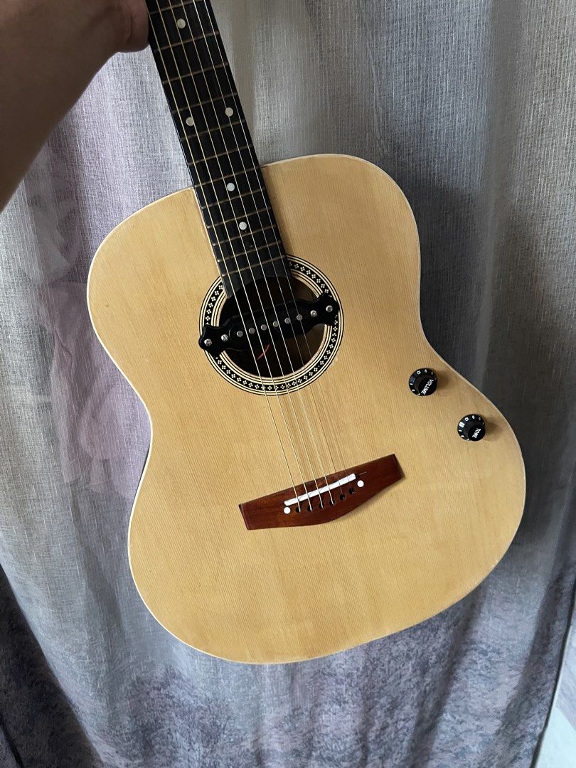 Lumanog Acoustic Guitar with Pickup (Category: Musical Instruments) located in Manila. Submitted by vincentrto45822 (Listing ID 1461940372, Image 1). Description: - Acoustic-electric guitar - Natural wood finish body - Black neck and back - Built-in pickup with volume and tone controls - Versatile for unplugged or amplified playing - Ready for a new owner.