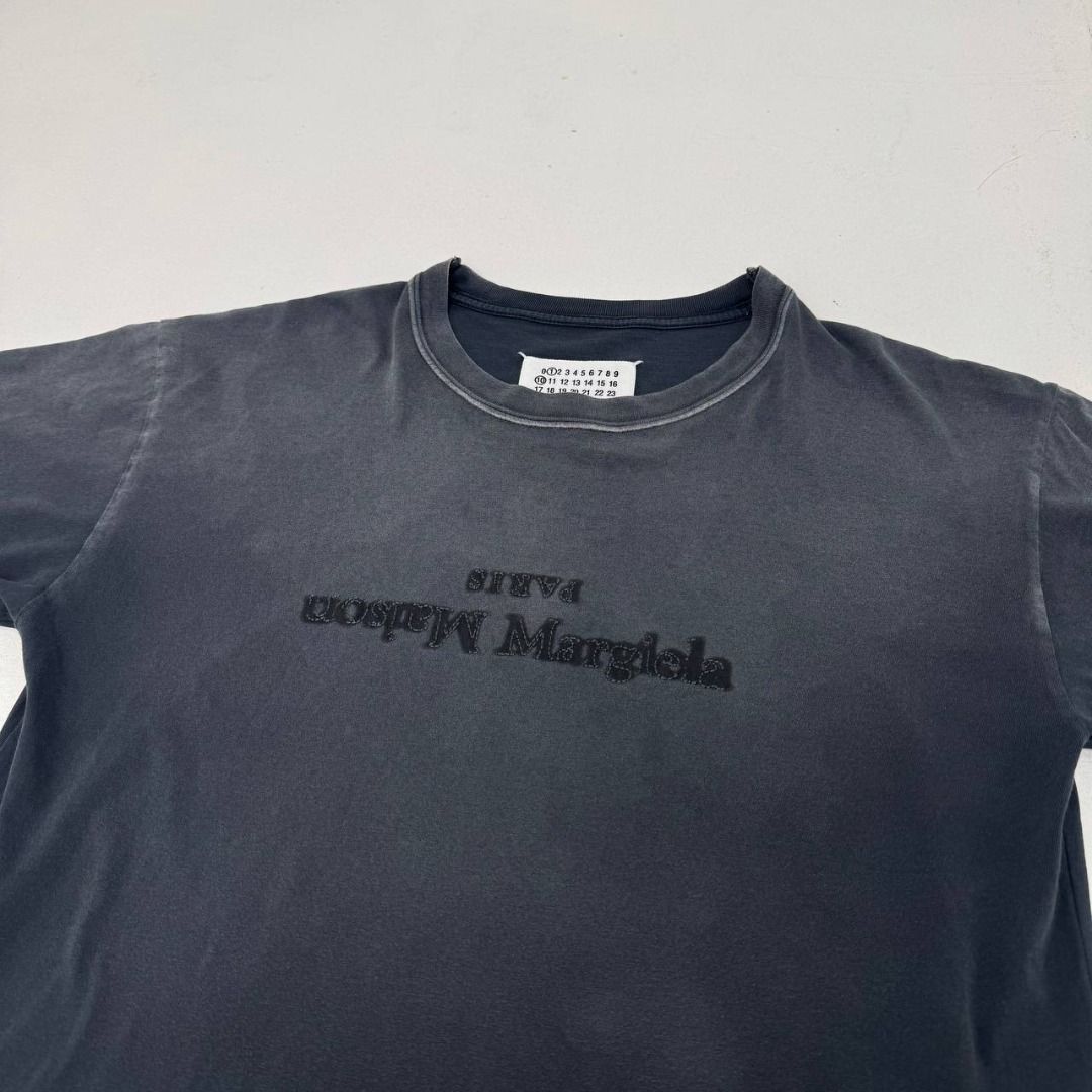 Maison Margiela Reverse Logo tee (Category: Luxury Apparel) located in Quezon City. Submitted by johnpaulperezzz (Listing ID 1461899472, Image 2). Description: NAME: Maison Margiela Reverse Logo tee COLOR: Black SIZE: Small FIT: Small Dimension: Width: 19 Length: 26 Shoulder: 18 Sleeves: 6 Hem: 21 CONDITION: 9/10 ISSUE: None PRICE: 8.5k .
