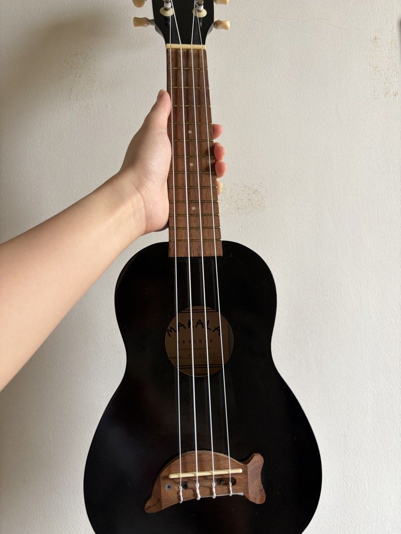 Makala Ukulele (Soprano size) (Category: Musical Instruments) located in Manila. Submitted by aman.sinaya01 (Listing ID 1461810282, Image 1). Description: - Black Makala Ukulele (Model MK-S/BK) - Includes a black gig bag - Ideal for beginners or new players - Features white tuning pegs - Unique wooden bridge design - Ready to play out of the box.