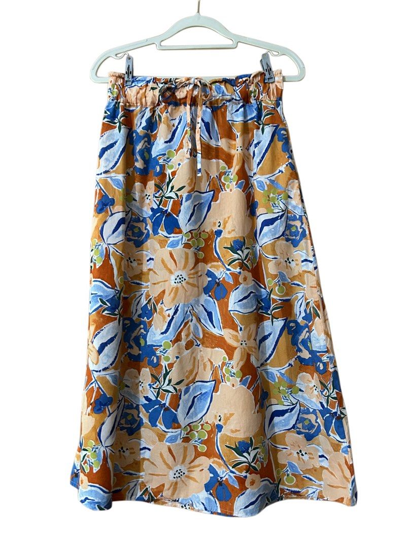Mango Floral Print Midi Skirt (Category: Skirts) located in Baguio. Submitted by tresmariascloset13 (Listing ID 1461880378, Image 3). Description: - Mango midi skirt - Vibrant floral print (orange, blue, white) - Size Small - Elasticated waistband with drawstring tie .