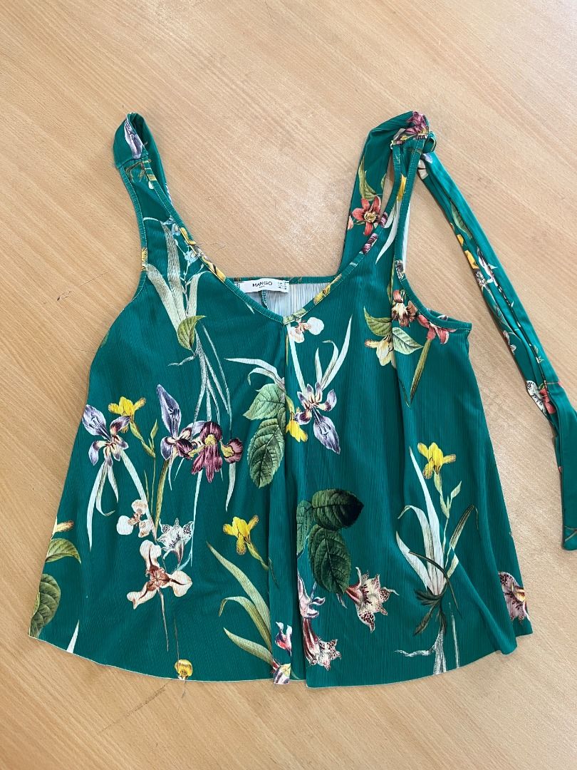Mango Green Floral Print Tank Top (Category: Sleeveless) located in San Juan City. Submitted by urgirlcreates (Listing ID 1461901709, Image 1). Description: Mango Green Floral Print Tank Top Price: ₱250 Brand: Mango Color: Blue Green Size: XS-S Style: with Tie Straps Condition: Used lightly, no flaws Rsf: Decluttering clothes, moving out.