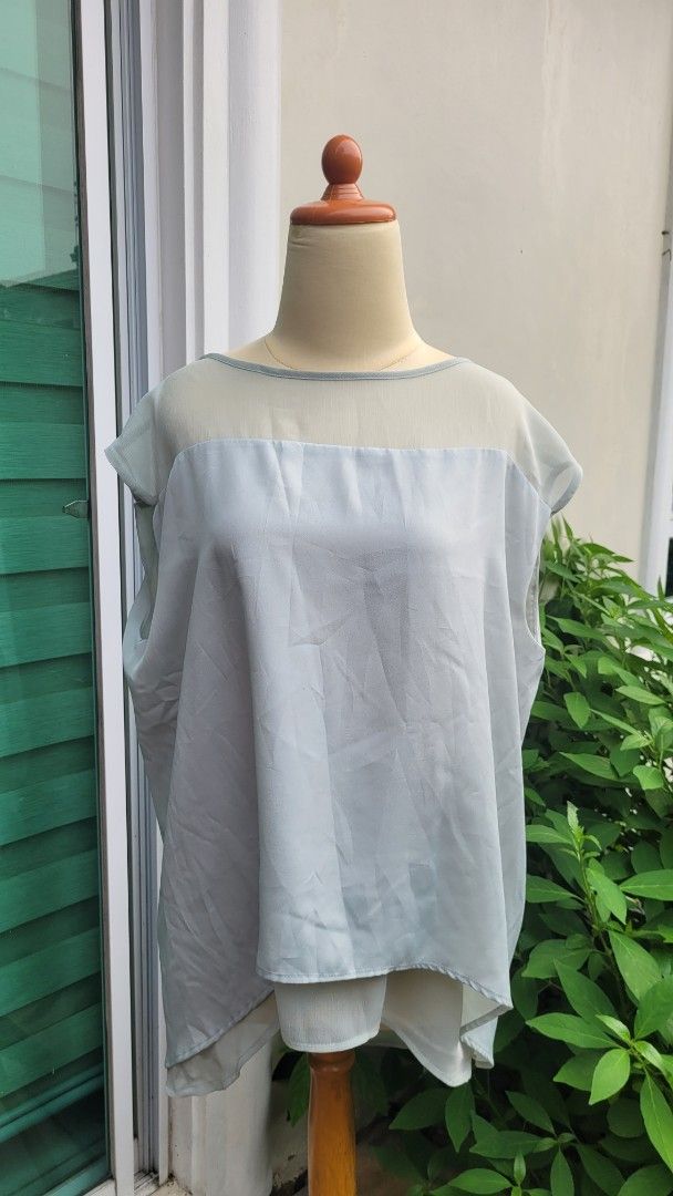 Mango Suit Light Blue Sheer Blouse Size L (Category: Blouses) located in Muntinlupa City. Submitted by havilahph (Listing ID 1461864618, Image 1). Description: Light blue sheer blouse from Mango Suit. Size L. Made in Vietnam. Lightweight and airy fabric. Great for layering or wearing on its own. Simple and chic design..