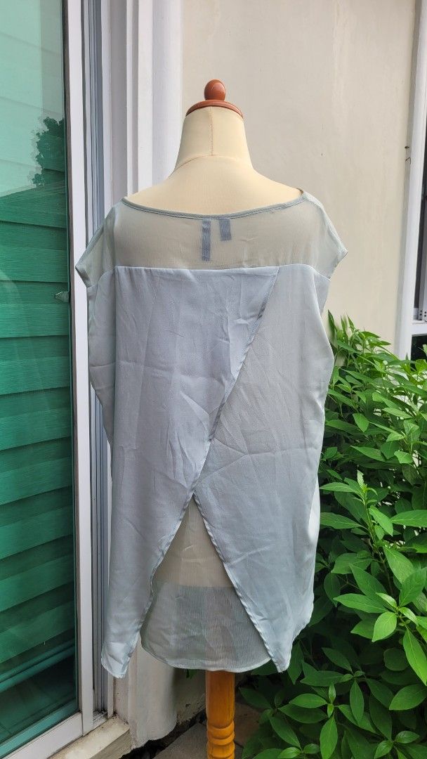 Mango Suit Light Blue Sheer Blouse Size L (Category: Blouses) located in Muntinlupa City. Submitted by havilahph (Listing ID 1461864618, Image 3). Description: Light blue sheer blouse from Mango Suit. Size L. Made in Vietnam. Lightweight and airy fabric. Great for layering or wearing on its own. Simple and chic design..