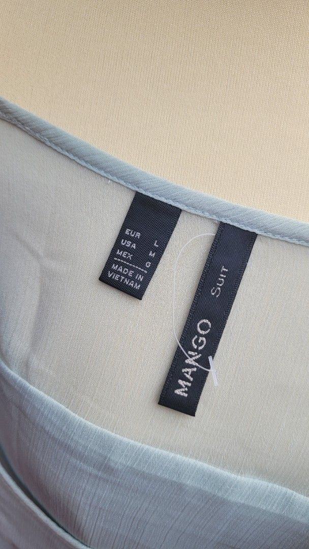 Mango Suit Light Blue Sheer Blouse Size L (Category: Blouses) located in Muntinlupa City. Submitted by havilahph (Listing ID 1461864618, Image 2). Description: Light blue sheer blouse from Mango Suit. Size L. Made in Vietnam. Lightweight and airy fabric. Great for layering or wearing on its own. Simple and chic design..