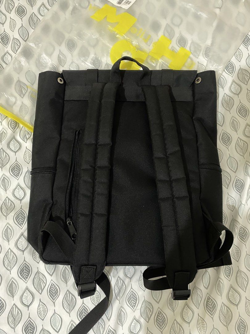 M.A.H Black Canvas Backpack (Category: Backpacks) located in Quezon City. Submitted by irldn_ (Listing ID 1461930748, Image 2). Description: - Brand: M.A.H - Color: Black - Material: Canvas - bought it for 1,720, selling it for 1,200 - Main compartment with internal pockets - Additional zip pocket on the back - Secure buckle closures on the front flap - Adjustable straps for comfort - Ideal for everyday use or travel.