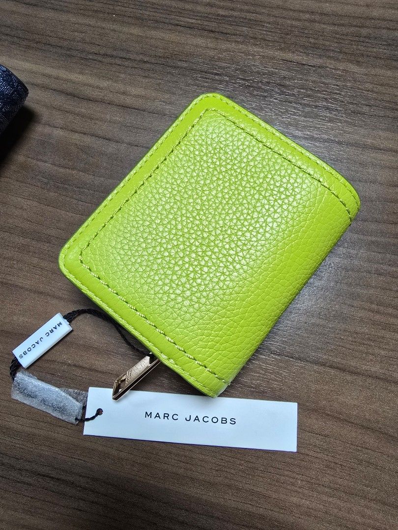 Marc Jacobs Lime Green Leather Trifold Wallet (Category: Wallets & Card holders) located in Davao. Submitted by declutterbyx (Listing ID 1461897221, Image 2). Description: - Brand: Marc Jacobs - Color: Lime Green - Material: Leather - Style: Trifold Wallet - Interior Features: Card slots, zip coin pocket - Includes: Original tags - Benefit: Keeps essentials organized.