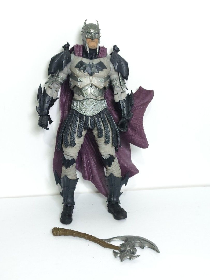 Mcfarlane DC Comics Batman Medieval Armor Action Figure with Axe (Category: Figurines & Statues) located in Abucay. Submitted by lxtoyverse (Listing ID 1461828215, Image 1). Description: - DC Comics Batman Action Figure - Unique medieval-inspired armor design - Includes an axe accessory - Features a deep purple cape - Ideal for collectors and Batman fans.