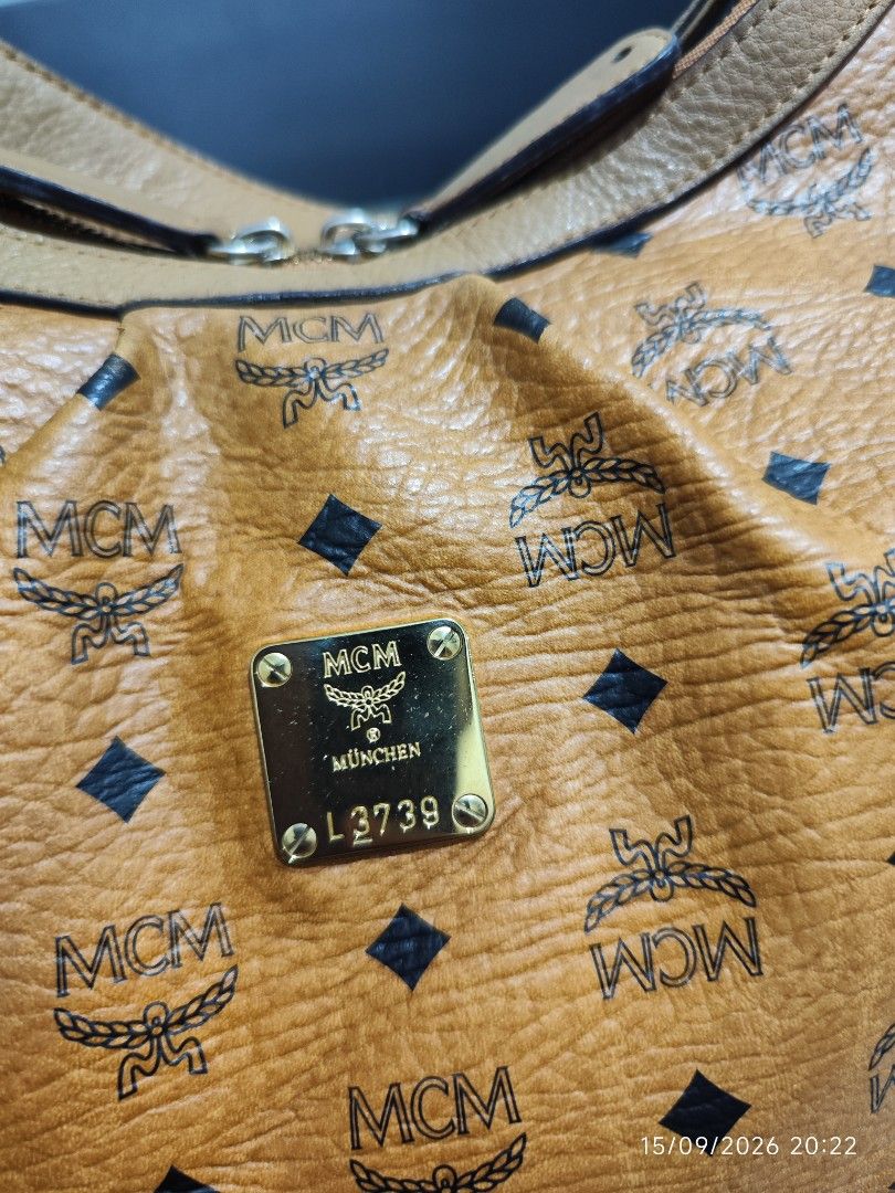 MCM Cognac Monogram Shoulder Bag Hobo Bag (Category: Luxury Bags & Wallets) located in Cavite. Submitted by isodanna0811-97013 (Listing ID 1461940479, Image 2). Description: -Lowest price Guaranteed for this condition. -Pwede tumawad, pm lang po -Korea source -Original with white tag -universal dust bag only Bag Description: - Rank: AB -Classic MCM shoulder bag - Signature monogram print - Tan leather trim and strap - Gold-tone hardware - Zipper 