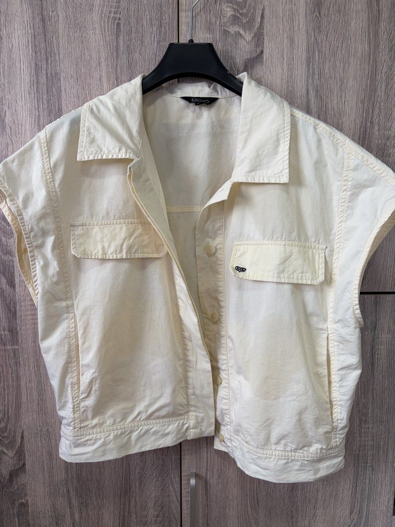 MEMO Cream Sleeveless Collared Button-Up Vest (Category: Sleeveless) located in Manila. Submitted by akingkingking (Listing ID 1461850106, Image 1). Description: - MEMO cream sleeveless vest - Collared neckline - Button-up front closure - Two chest pockets - Ideal for layering and easy styling - buyer to arrange and shoulder shipping fee.