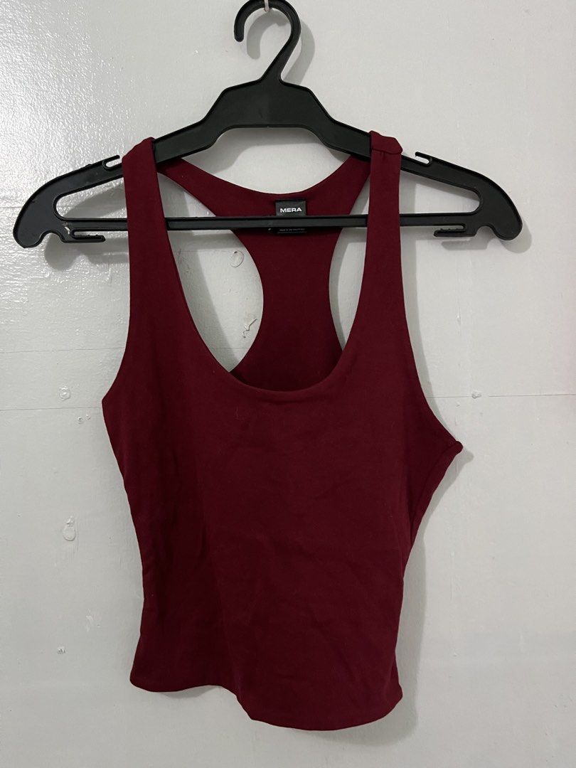 MERA Burgundy Racerback Tank Top (Category: Sleeveless) located in Antipolo. Submitted by starraid777 (Listing ID 1461852192, Image 1). Description: - Burgundy racerback tank top from MERA - Comfortable and stretchy material - Ideal for workouts or casual wear - Versatile: pairs well with leggings or shorts - Easy to mix and match with other outfits.