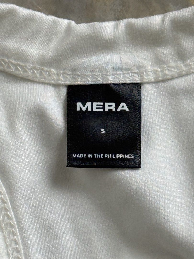 MERA Mera Gia Racerback Tank Top (Category: Sleeveless) located in San Mateo. Submitted by aifoslvdr (Listing ID 1461831531, Image 2). Description: - White MERA tank top - Racerback style.
