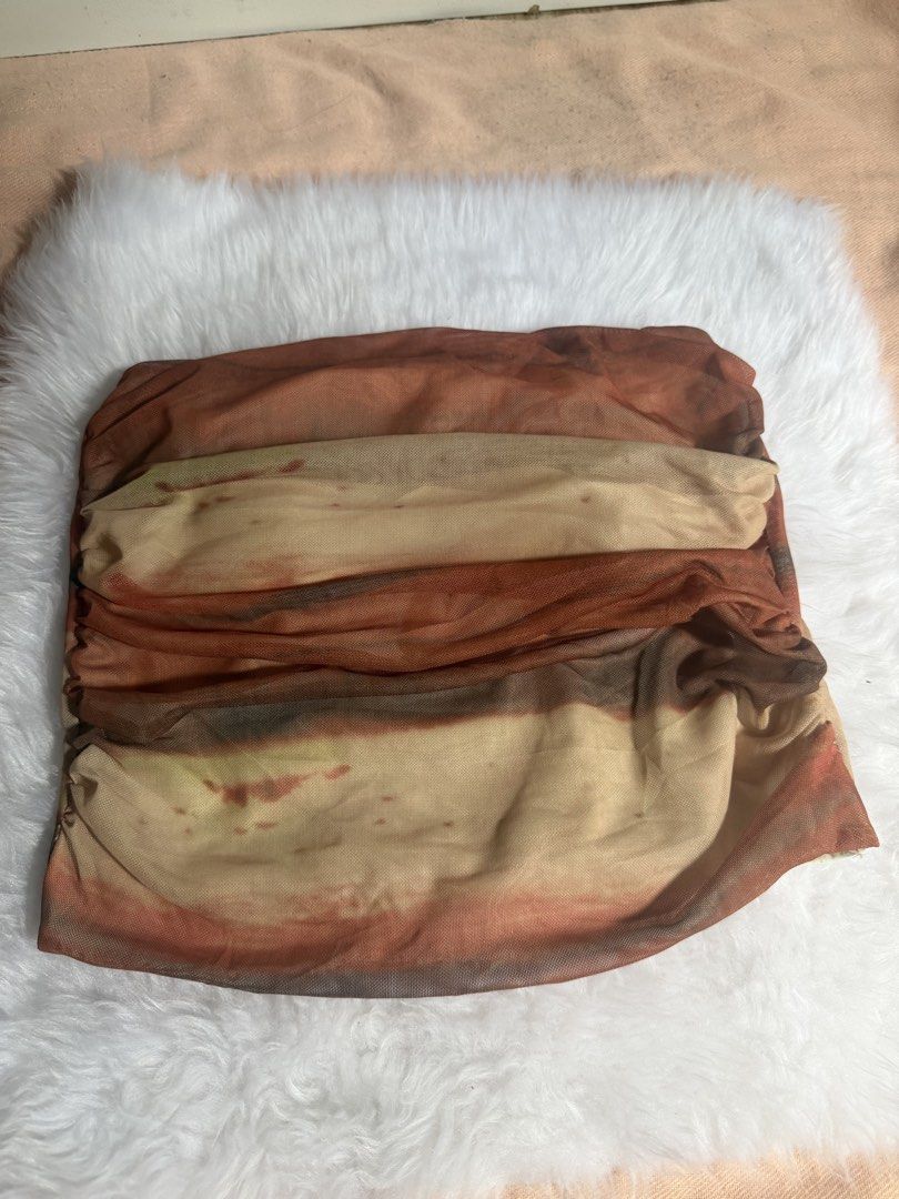 Mesh Ruched Tie-Dye Tube Top (Category: Sleeveless) located in San Vicente. Submitted by chinn5 (Listing ID 1462023627, Image 1). Description: - Trendy tie-dye mesh tube top - Features all-over ruching for texture - Beautiful earthy color palette (brown, beige, hints of orange) - Strapless design - Versatile for casual days or nights out.
