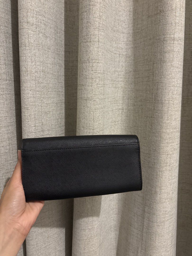 Michael Kors Black Leather Wallet with Gold Clasp (Category: Wallets & Card holders) located in Manila. Submitted by viee1777 (Listing ID 1461925993, Image 2). Description: - Authentic Michael Kors wallet - Color: Black leather - Closure: Gold turn-lock - Interior: Ample space for cards & cash, clean - Versatile: Ideal for everyday or night out - Condition: Great, clean interior .