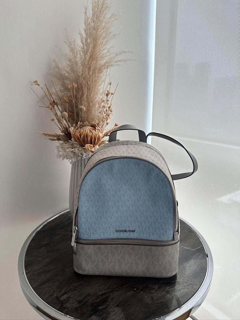 Michael Kors MK Signature Backpack - Light Blue & Grey (Category: Backpacks) located in Manila. Submitted by trueriver02 (Listing ID 1461855304, Image 2). Description: - Michael Kors backpack - authentic - Signature MK print all over - Stylish two-tone design: light blue and grey - Secure zipper closure - Adjustable straps for comfort - Ideal for everyday use - Last stock available! -NEW NEVER USED.