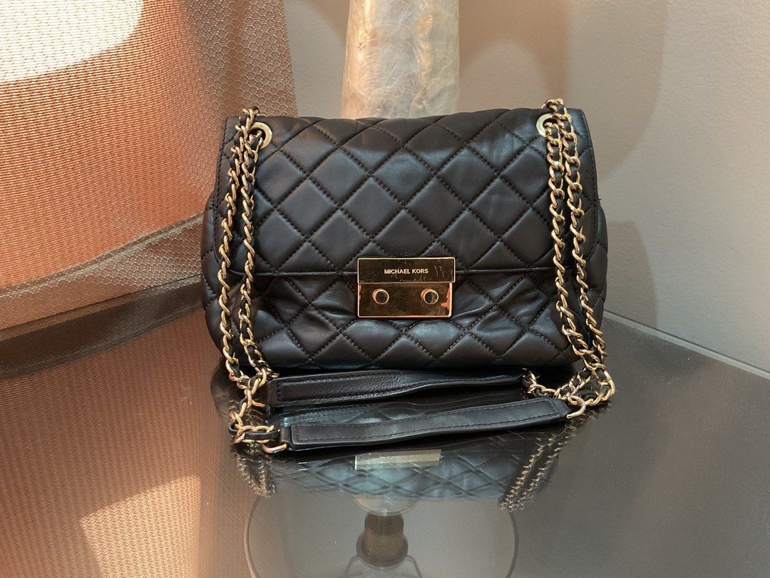 Michael Kors Quilted Leather Chain Shoulder Bag (Category: Luxury Bags & Wallets) located in Cagayan de Oro. Submitted by ericlarkyl89146 (Listing ID 1461849089, Image 1). Description: - Michael Kors black quilted leather shoulder bag - Gold-tone hardware and chain strap - Interior zip pocket and card slots - Versatile for everyday or evening use - Clean inside and out, ready for a new owner.