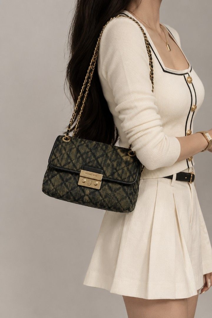 Michael Kors Sloan Denim Chain Bag (Category: Luxury Bags & Wallets) located in Baguio. Submitted by PreiLoveMaria (Listing ID 1416824942, Image 1). Description: Michael Kors Sloan Denim Bag This Sloan Denim bag features a classic diamond quilted pattern. 👜 Condition: Good used condition • Normal signs of wear • Visible scratches on the hardware Kindly check the Detailed photos Shipping via J&T only No COD and COP ❤️.