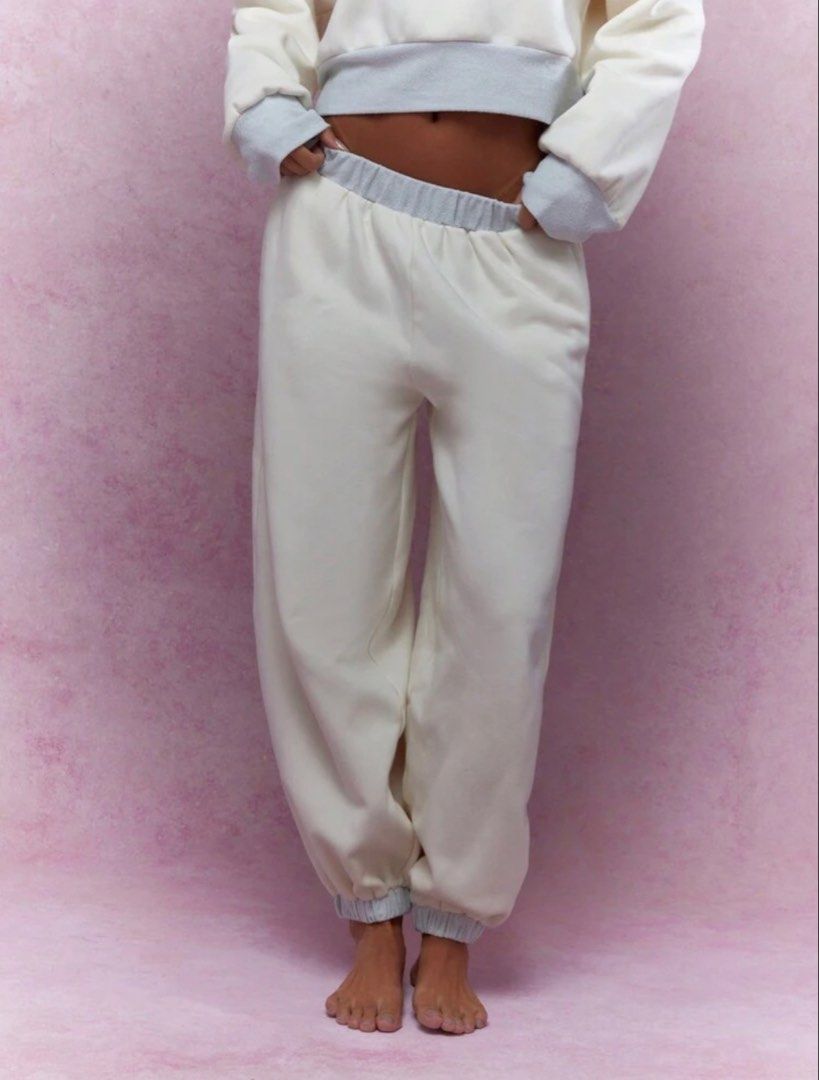 Missguided Cream Sweatpants with Grey Trim (Category: Other Bottoms) located in Villasis. Submitted by juliaxgamboa (Listing ID 1461877476, Image 1). Description: - Cream colored sweatpants - Elastic waistband and cuffs - Relaxed fit for ultimate comfort - Ideal for lounging or casual outings - Sold as a set with a matching cropped hoodie.