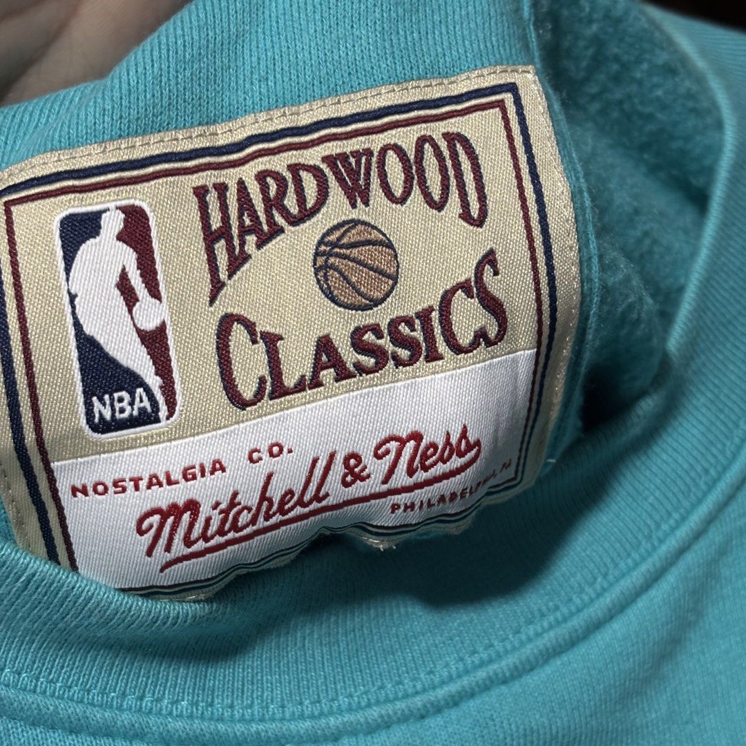 Mitchell & Ness NBA Hardwood Classics Spurs 1996 Sweatshirt (Category: Coats, Jackets and Outerwear) located in Caloocan City. Submitted by bonsatocha43876 (Listing ID 1461983555, Image 2). Description: - Mitchell & Ness Spurs Hardwood Classics sweatshirt - Features the iconic 1996 season - Striking teal, pink, and black colorway - Long sleeves for comfort - Brand new with original tags attached - Measurements: Width 20 inches, Length 26 inches -