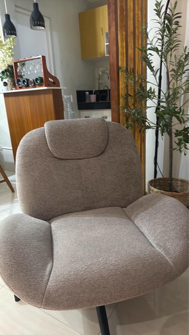 Modern Swivel Accent Chair with Headrest (Category: Chairs) located in Calamba. Submitted by nicalison (Listing ID 1461922841, Image 2). Description: -calamba area -can do meet up around calamba or alabang -originally bought for ₱9,500 - Comfortable accent chair with swivel base - Upholstered in textured grey fabric - Features a supportive headrest - Modern, sleek design fits various decor styles - Ideal for living rooms or bedrooms - Perfect spo