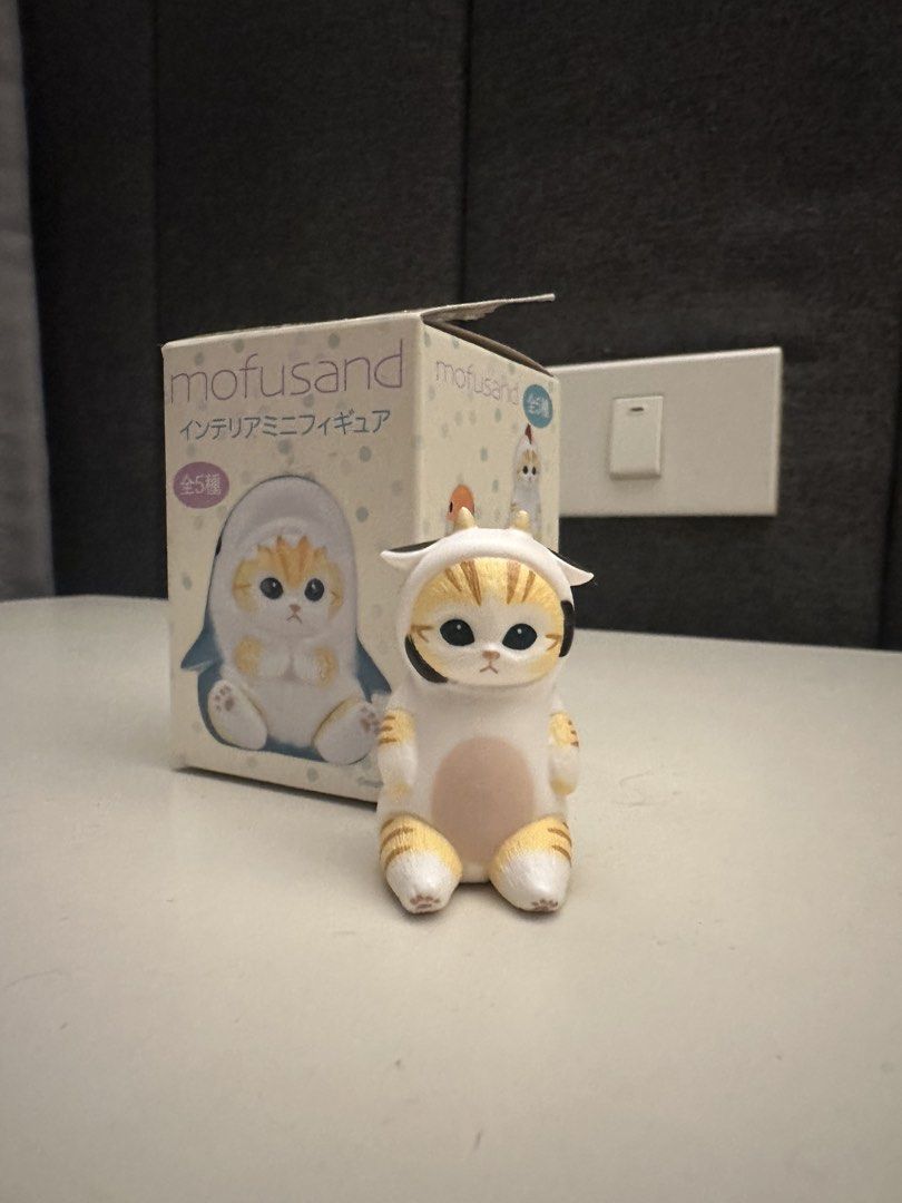 Mofusand Interior Mini Figure Cow Cat (Category: Designer & Blind Box Toys) located in Manila. Submitted by urlocal_seller (Listing ID 1461974632, Image 1). Description: - Adorable Mofusand mini figure - Features the cute cow cat design - Includes original packaging - Box shows some signs of wear - Ideal for Mofusand collectors - Makes a charming desk decoration.