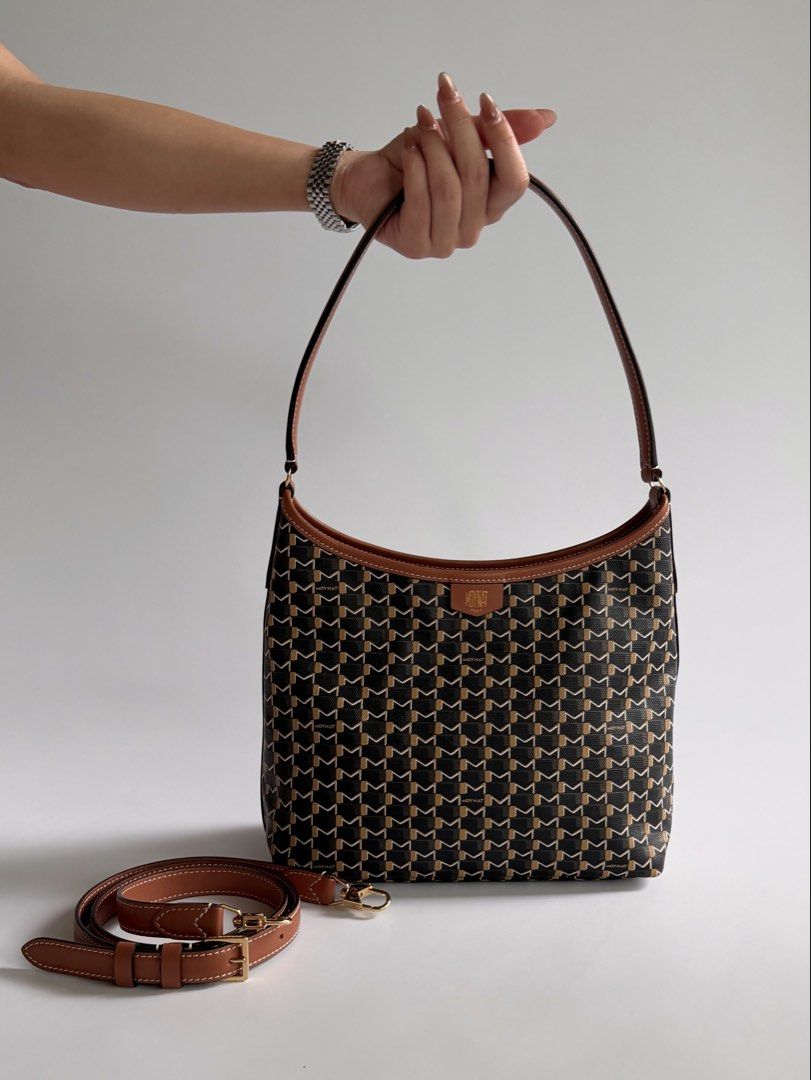 Moynat Hobo Mini in Black/ Tan (Category: Luxury Bags & Wallets) located in Quezon City. Submitted by lian_closet (Listing ID 1461987772, Image 1). Description: Moynat Hobo Mini in Black/ Tan Best Price: ₱90,000 Preloved Comes with Detachable Long Strap, Care Booklets, Dust Bags, Receipt & LegitGrails Authenticity Certificate Preloved Rating: 9.5/10 Excellent No glazing issues Light scuff on one corner Interior is clean .