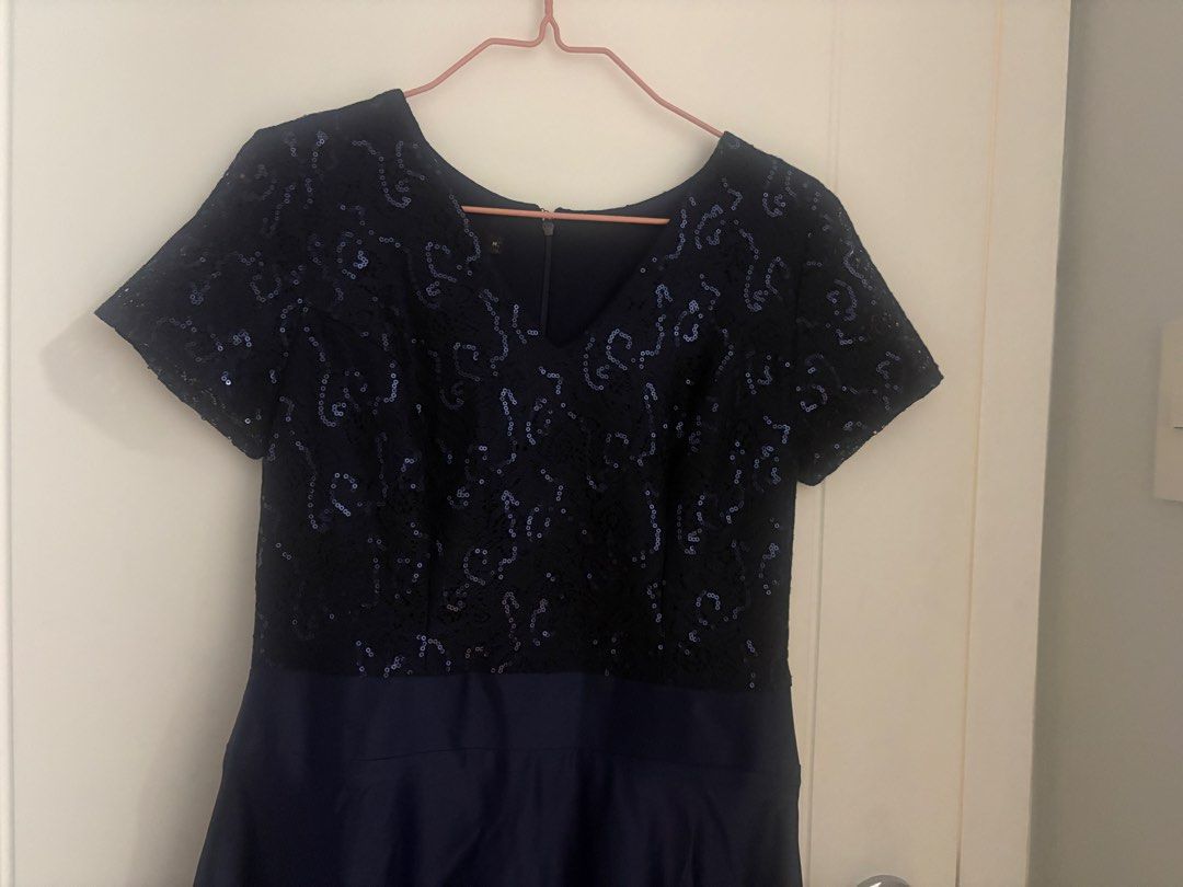 Navy Blue Sequin Lace Maxi Dress (Category: Dresses) located in Pasig City. Submitted by AddyCB (Listing ID 1462027297, Image 3). Description: - Navy blue maxi dress - Sequin lace top with short sleeves - Smooth, flowing skirt fabric - Zipper closure at the back - Ideal for formal events and parties - Comfortable and flattering fit - Bought from SM - Very good condition RFS: Decluttering (just stored) Size: Medium .