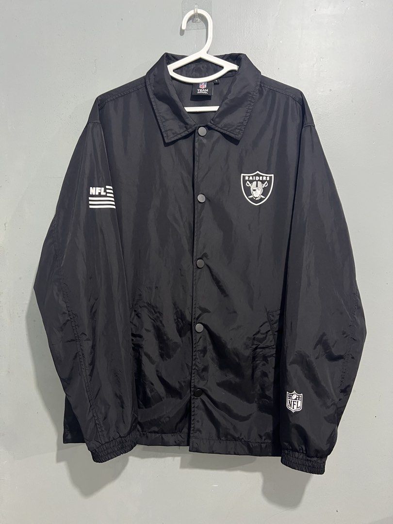 NFL Las Vegas Raiders Team Apparel Jacket (Category: Coats, Jackets and Outerwear) located in Baguio. Submitted by costacash (Listing ID 1461841030, Image 2). Description: - Black Raiders jacket from NFL Team Apparel - Features iconic Raiders shield logo on the back - NFL branding on sleeve and front - Convenient snap button closure - Elasticated cuffs and hem for a comfortable fit - Size: Large (L) - A must-have for any Las Vegas Raiders fan! - 