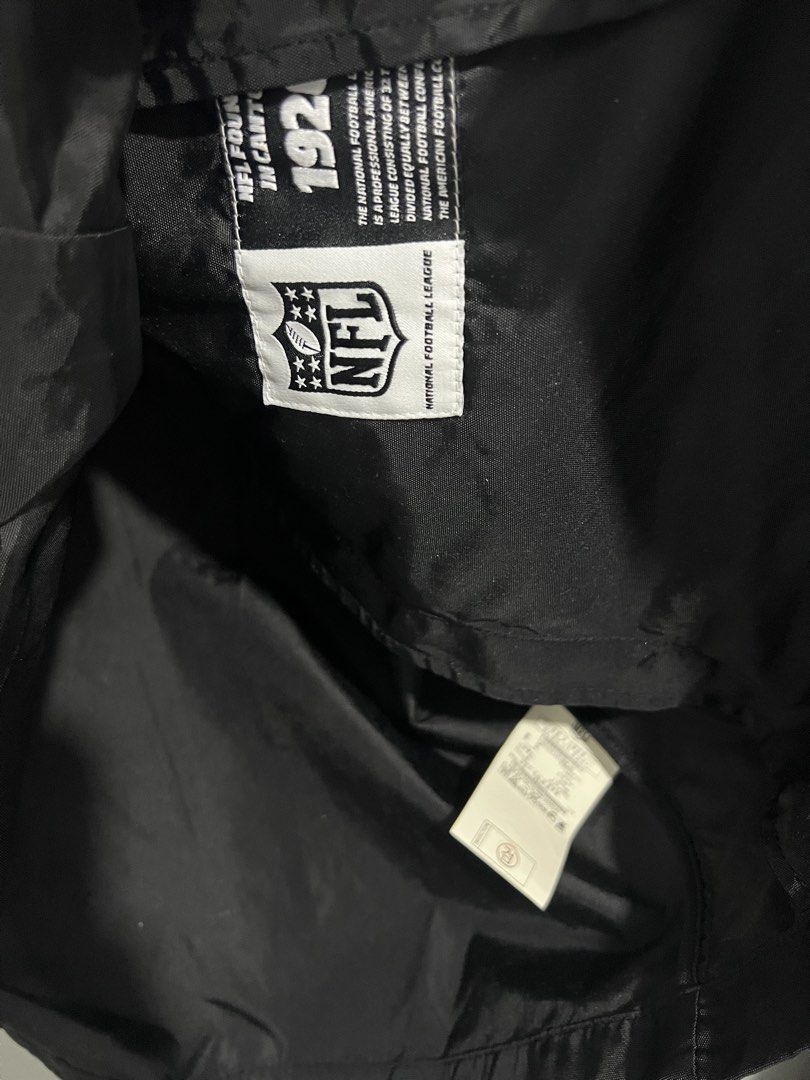 NFL Las Vegas Raiders Team Apparel Jacket (Category: Coats, Jackets and Outerwear) located in Baguio. Submitted by costacash (Listing ID 1461841030, Image 3). Description: - Black Raiders jacket from NFL Team Apparel - Features iconic Raiders shield logo on the back - NFL branding on sleeve and front - Convenient snap button closure - Elasticated cuffs and hem for a comfortable fit - Size: Large (L) - A must-have for any Las Vegas Raiders fan! - 