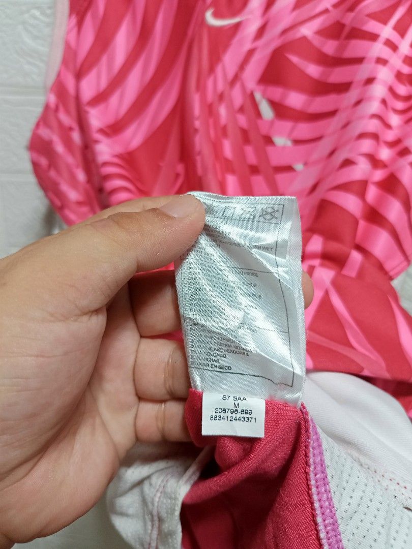 Nike (Category: Activewear) located in Danao, Cebu. Submitted by 6000thrifts.ph (Listing ID 1461985226, Image 3). Description: - Brand: Nike - Type: Tank Top - Color: Pink with leaf print - Features: Breathable mesh side panels - Size: M.