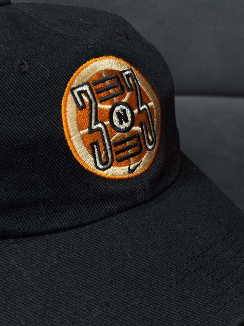 Nike 1999 Embroidered Baseball Cap (Category: Caps & Hats) located in Antipas. Submitted by charsonaesthetics (Listing ID 1461969503, Image 2). Description: - Black Nike baseball cap - Embroidered circular logo on front with '333' and 'N' - '1999' and Nike swoosh embroidered on the back - Adjustable strap for a comfortable fit - Ideal for casual outfits.