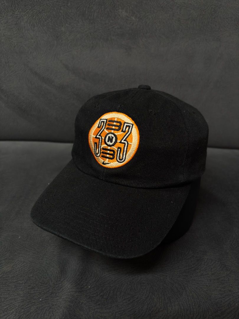 Nike 1999 Embroidered Baseball Cap (Category: Caps & Hats) located in Antipas. Submitted by charsonaesthetics (Listing ID 1461969503, Image 1). Description: - Black Nike baseball cap - Embroidered circular logo on front with '333' and 'N' - '1999' and Nike swoosh embroidered on the back - Adjustable strap for a comfortable fit - Ideal for casual outfits.
