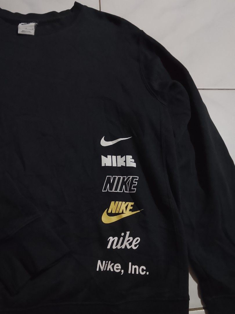 Nike Black Crewneck Sweatshirt with Multiple Logos (Category: Coats, Jackets and Outerwear) located in Cavite. Submitted by ara.thrifts (Listing ID 1461812165, Image 2). Description: - Black Nike crewneck sweatshirt - Features a stack of Nike logos down the side - Size: Large width " 22" length "28" no issue as new.