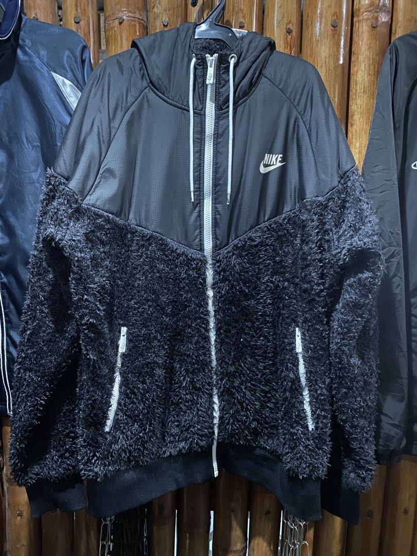 Nike Black Sherpa Lined Hooded Jacket (Category: Coats, Jackets and Outerwear) located in Puerto Princesa. Submitted by 4stylefit (Listing ID 1461911405, Image 1). Description: - Black Nike jacket - Sherpa fleece lower half and hood lining - Full zip front with white accents - Drawstring hood and pockets - Nike logo on chest and zipper pull - Ideal for staying warm.
