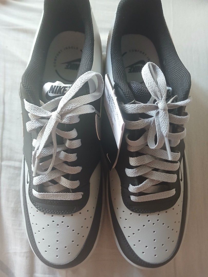 Nike Court Vision Low Sneakers (Category: Sneakers) located in Quezon City. Submitted by raaaaaff (Listing ID 1461912109, Image 1). Description: Classic Nike low-top sneakers in black and grey. Features a perforated toe box and light grey laces. Perfect for daily wear. Brand new with original tags. Size 11 Brand New Original No Box.