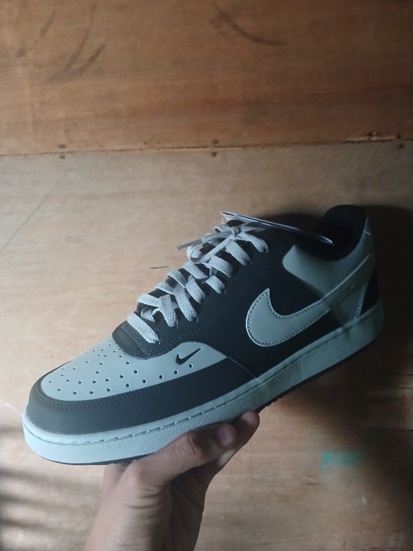 Nike Court Vision Low Sneakers (Category: Sneakers) located in Quezon City. Submitted by raaaaaff (Listing ID 1461912109, Image 3). Description: Classic Nike low-top sneakers in black and grey. Features a perforated toe box and light grey laces. Perfect for daily wear. Brand new with original tags. Size 11 Brand New Original No Box.