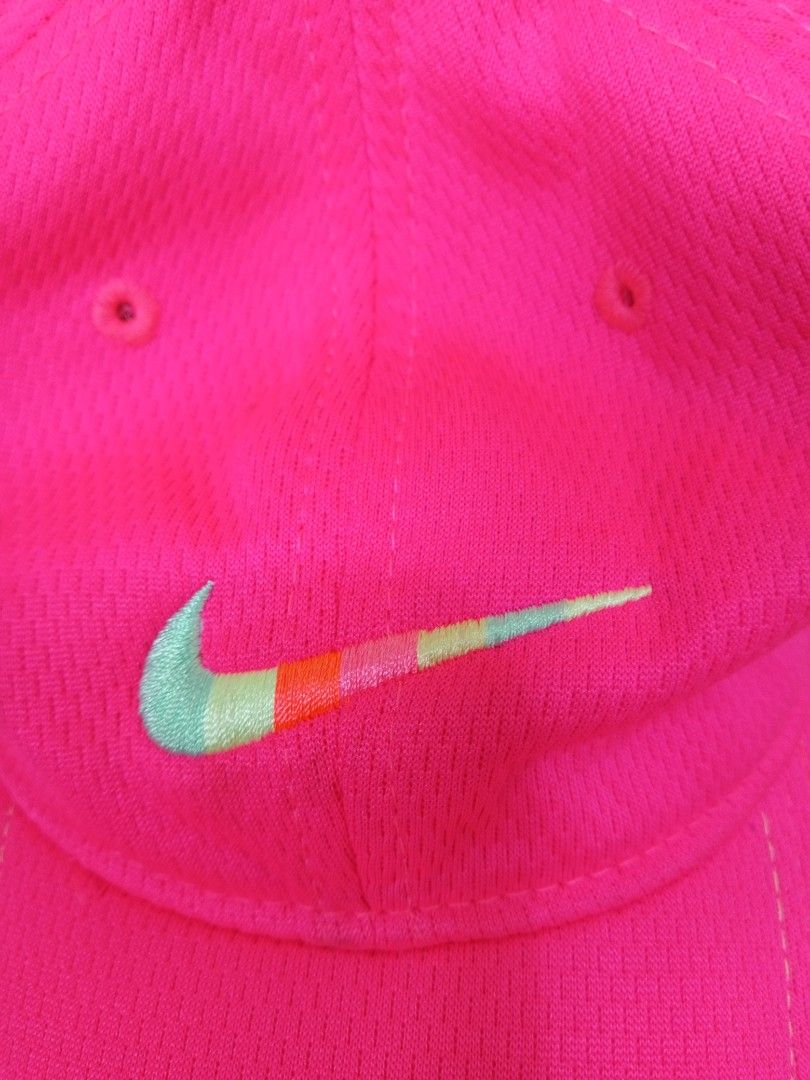 Nike Dri-Fit Pink Cap (Category: Caps & Hats) located in Manila. Submitted by onewikstraight (Listing ID 1461837284, Image 2). Description: - Vibrant bright pink Nike cap - Features iconic Nike swoosh with colorful gradient detail - Smaller swoosh on the back - Made with breathable Dri-Fit material - Adjustable strap for a customized fit - Ideal for sports activities or everyday casual wear 600+sf.