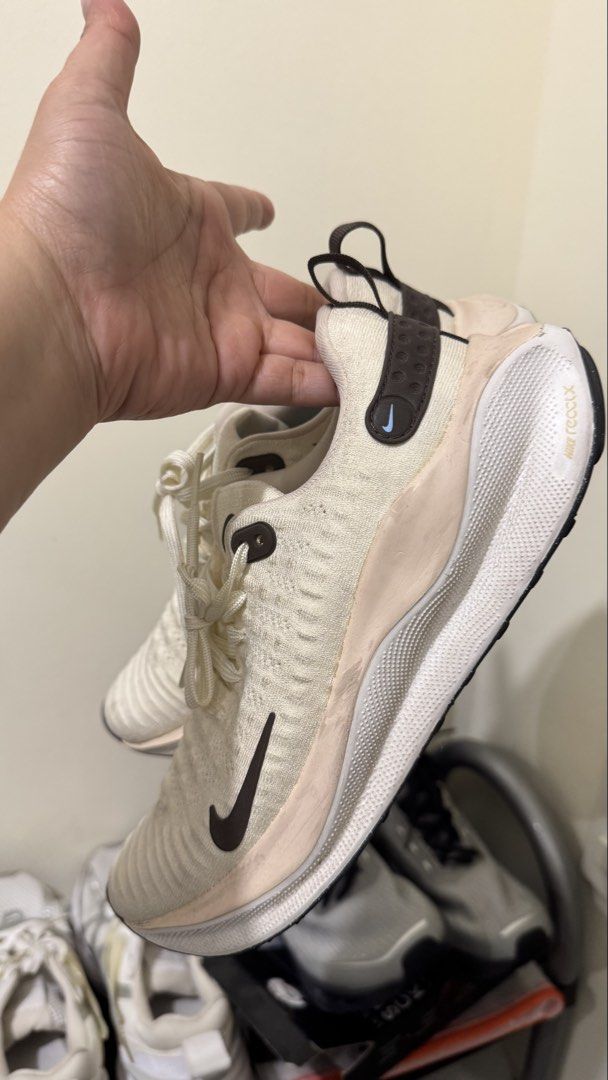 Nike Infinity Run 4 Running Shoes (Category: Sneakers) located in Las Pinas. Submitted by emquevedo (Listing ID 1461885262, Image 1). Description: - Lightweight Nike running shoes - Cream knit upper with pink accents - Dark brown Nike swoosh and heel tab - Soles with good grip - Suitable for running or casual wear - Minor scuffs on the pink midsole Used once for 5km fun run, minimal stain as shown on photo. .
