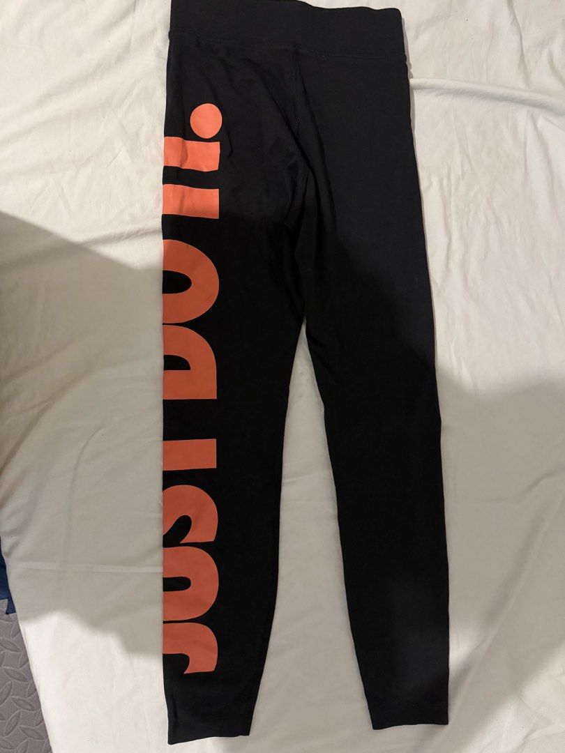 Nike Just Do It Black Leggings (Category: Activewear) located in Makati City. Submitted by malcolmkenji (Listing ID 1461897404, Image 1). Description: - Brand: Nike - Color: Black with coral orange 'Just Do It' slogan - Length: Full length - Features: Comfortable and stretchy material - Versatile: Ideal for workouts or casual wear.