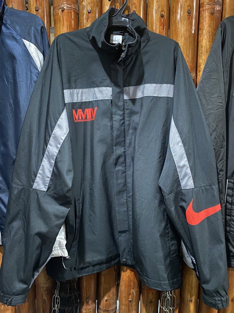 Nike MMIIV Jacket Black Red Swoosh (Category: Coats, Jackets and Outerwear) located in Puerto Princesa. Submitted by 4stylefit (Listing ID 1461911285, Image 1). Description: - Black Nike jacket - Size XL - Red swoosh logo - MMIIV graphic on front - Reflective stripes - Button and zip closure - Made in China.
