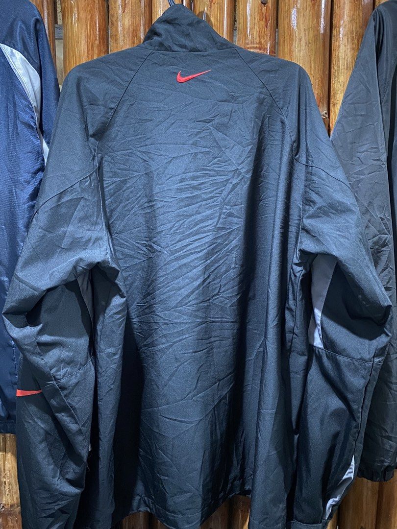 Nike MMIIV Jacket Black Red Swoosh (Category: Coats, Jackets and Outerwear) located in Puerto Princesa. Submitted by 4stylefit (Listing ID 1461911285, Image 2). Description: - Black Nike jacket - Size XL - Red swoosh logo - MMIIV graphic on front - Reflective stripes - Button and zip closure - Made in China.