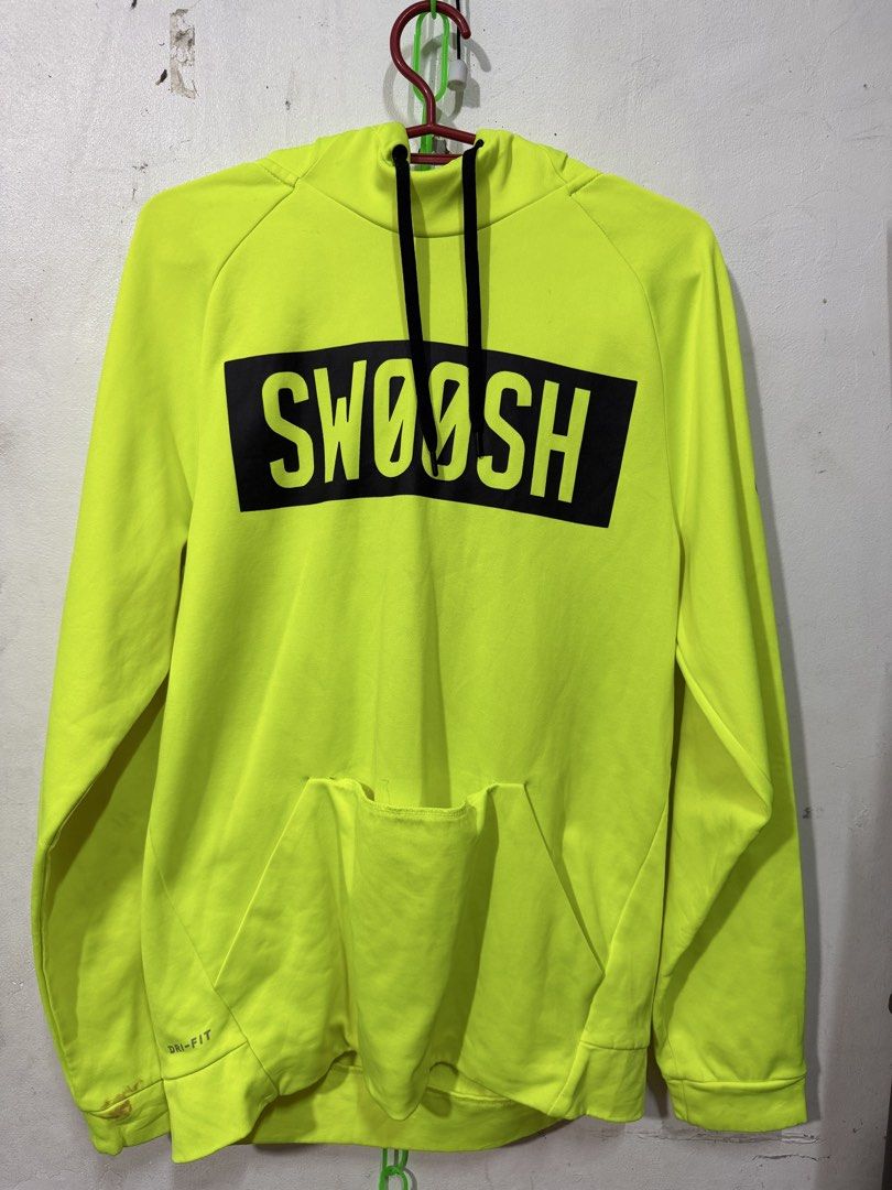 Nike swoosh drifit sweatshirt (Category: Activewear) located in Manila. Submitted by bunsmayo31 (Listing ID 1461992123, Image 1). Description: - Brand: Nike - Model: Swoosh Dri-FIT Sweatshirt - Color: Neon Yellow - Size: S - Features: Bold "SWOOSH" graphic, Dri-FIT technology for moisture-wicking - Style: Activewear, casual comfort.