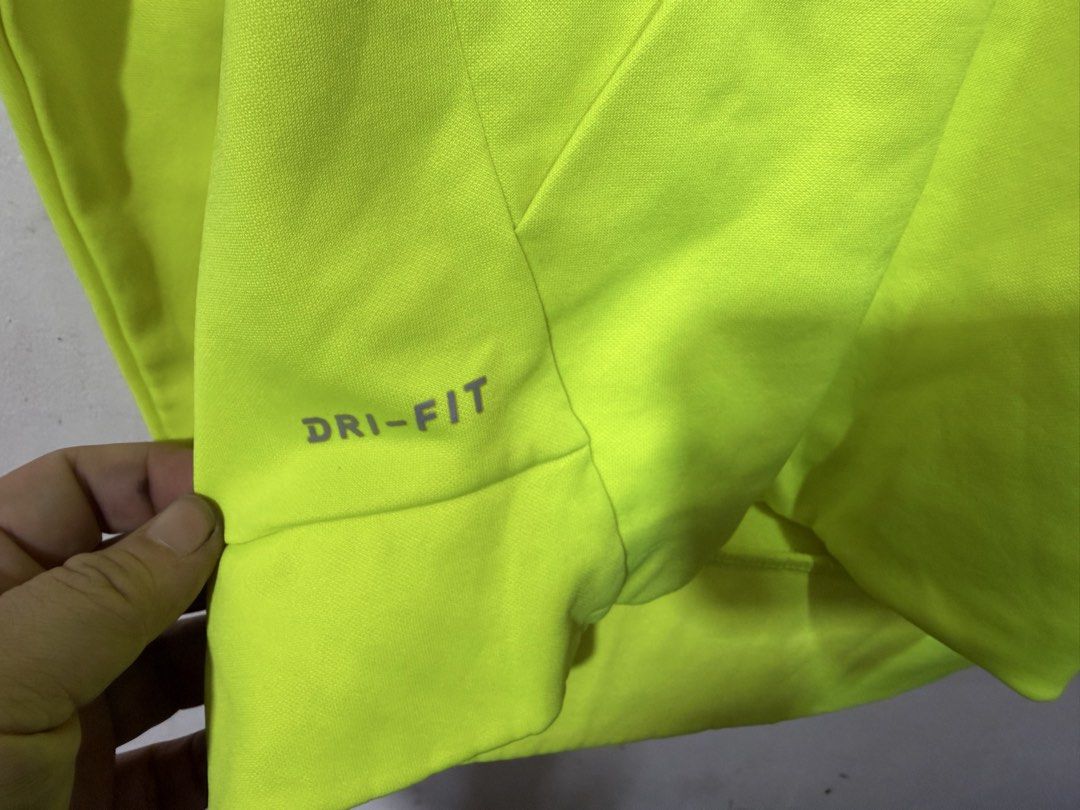 Nike swoosh drifit sweatshirt (Category: Activewear) located in Manila. Submitted by bunsmayo31 (Listing ID 1461992123, Image 2). Description: - Brand: Nike - Model: Swoosh Dri-FIT Sweatshirt - Color: Neon Yellow - Size: S - Features: Bold "SWOOSH" graphic, Dri-FIT technology for moisture-wicking - Style: Activewear, casual comfort.