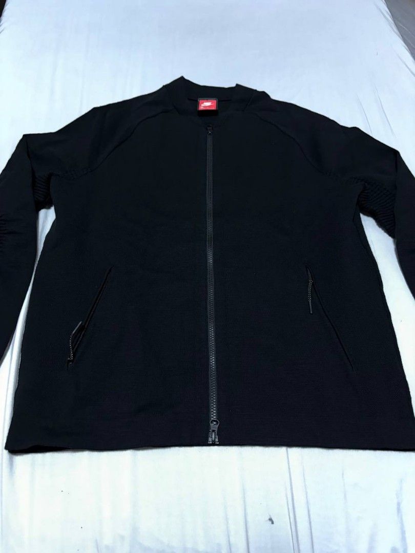 Nike Tech Fleece Rare Tech Pack Full Zip Jacket Black (Category: Coats, Jackets and Outerwear) located in Pasig City. Submitted by heneralsupremo1892 (Listing ID 1461798619, Image 1). Description: - Black Nike Tech Fleece jacket - Rare Tech Pack - Full zip closure - Front pockets - Ribbed detailing on sleeves and collar - Ideal for everyday wear or workouts - Comfortable and stylish.