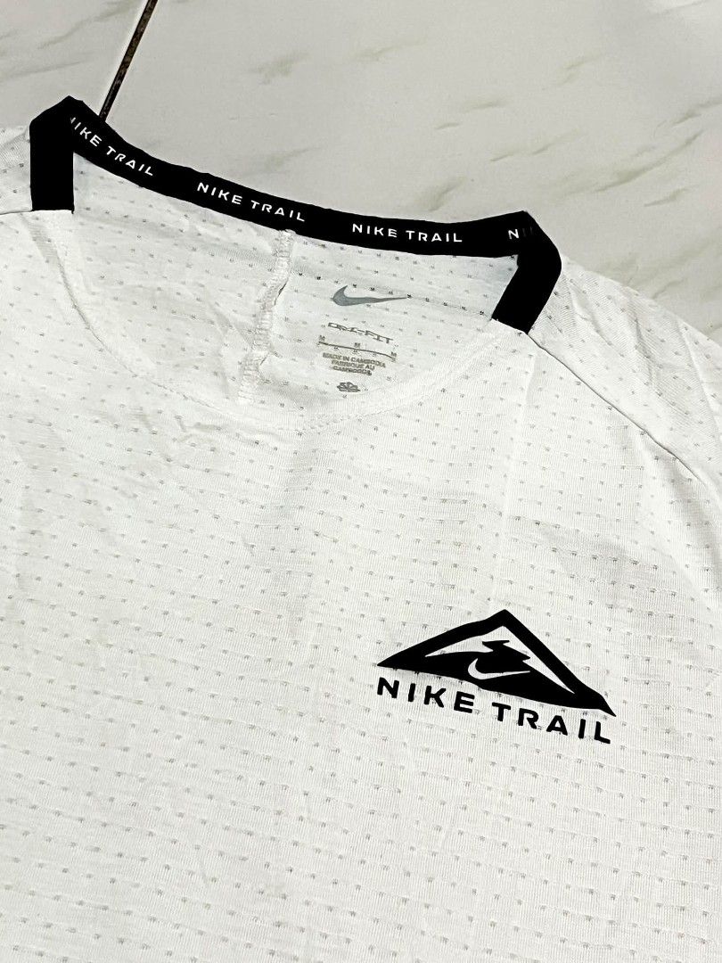 Nike Trail Drifit Men's Tshirt (Category: Tshirts & Polo Shirts ) located in Binalbagan. Submitted by dcorexyzzz (Listing ID 1461828231, Image 3). Description: Medium 18/27 Excellent condition No issues Need wash only - Dri-FIT material for superior breathability - Features the iconic Nike Trail logo on the chest - Reflective details on the sleeves for enhanced visibility - Ideal for running, hiking, and other outdoor activities.