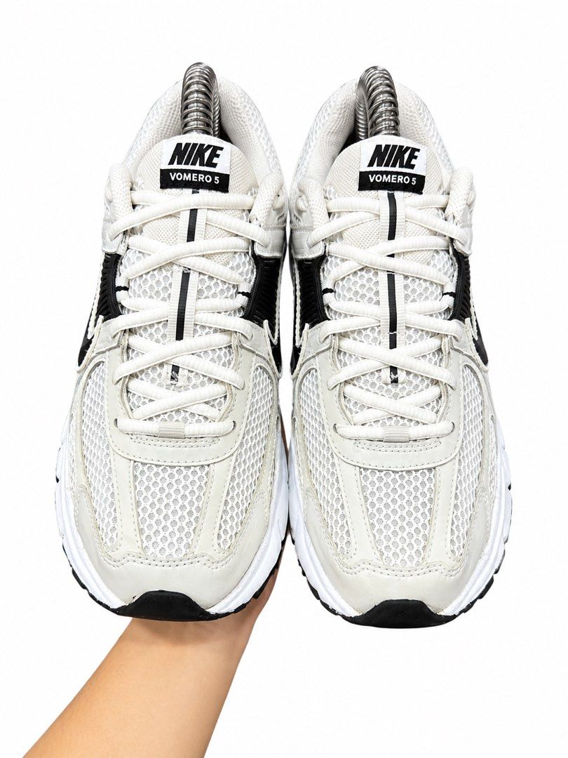 Nike Vomero 5 Sneakers White Black (Category: Sneakers) located in Valenzuela. Submitted by boutiquechic (Listing ID 1461921808, Image 3). Description: - Nike Vomero 5 running shoes - Color: White with black accents - Features: Breathable mesh upper, cushioned sole for comfort - Versatile: Great for running or everyday wear - Condition: Shows some signs of wear on the soles.