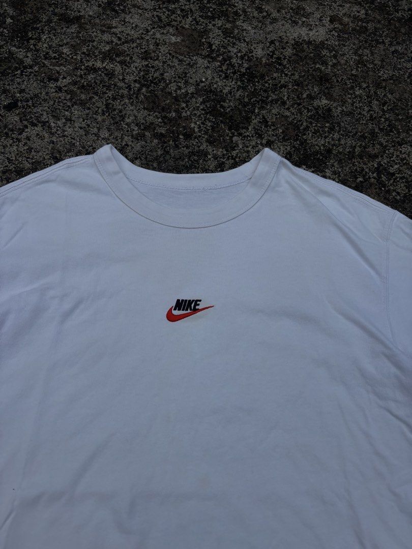 Nike White T-Shirt - Size M (Category: Shirts) located in Caloocan City. Submitted by elpotato (Listing ID 1461811587, Image 2). Description: - Classic white Nike t-shirt - Features a small embroidered Nike logo on the chest - Simple and versatile design - Great for everyday wear - Size: Medium (M) - Please check the label for care instructions.