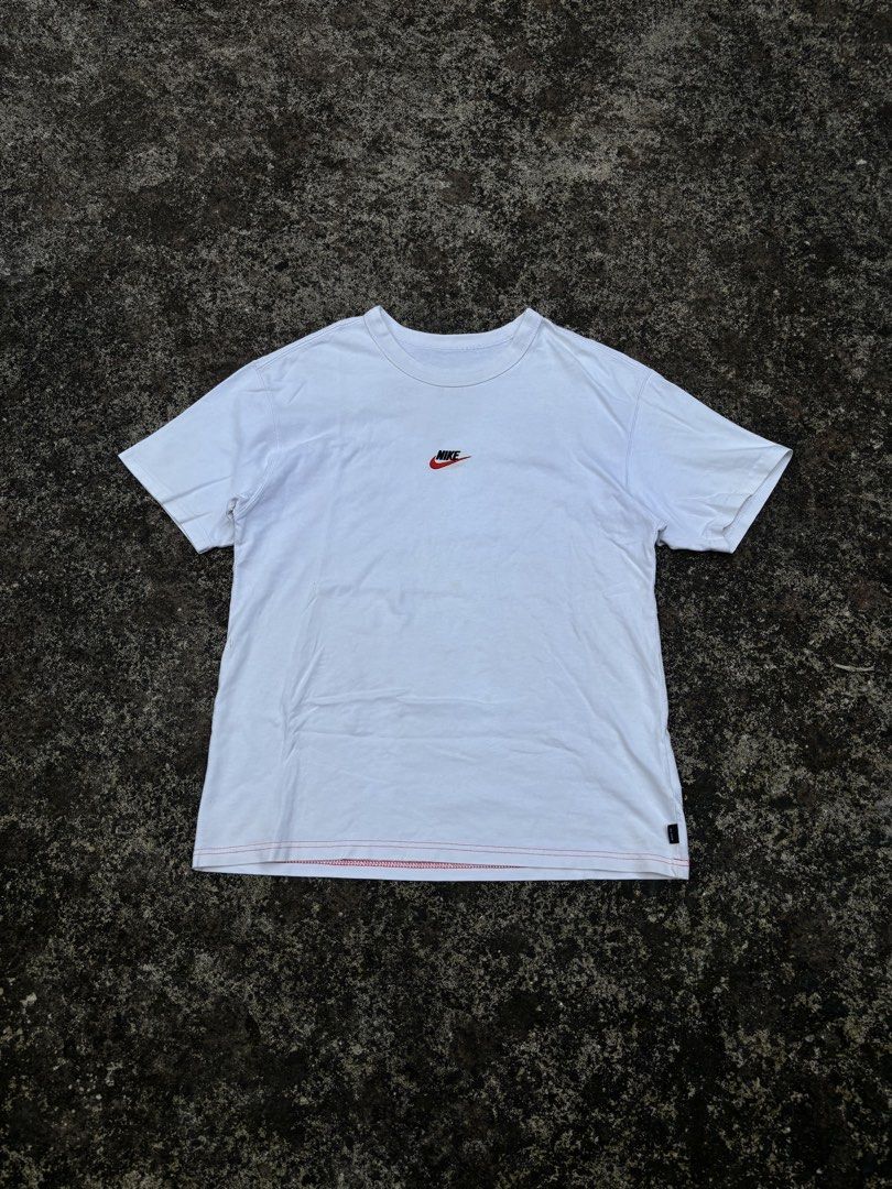 Nike White T-Shirt - Size M (Category: Shirts) located in Caloocan City. Submitted by elpotato (Listing ID 1461811587, Image 1). Description: - Classic white Nike t-shirt - Features a small embroidered Nike logo on the chest - Simple and versatile design - Great for everyday wear - Size: Medium (M) - Please check the label for care instructions.