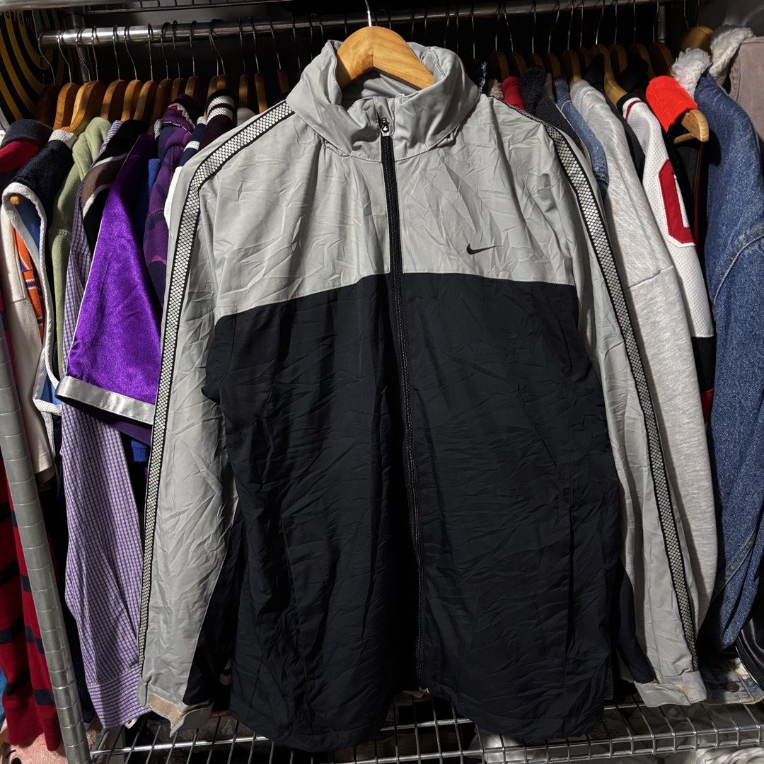 Nike Windbreaker Jacket - Grey/Black - Size L (Category: Coats, Jackets and Outerwear) located in Caloocan City. Submitted by bonsatocha43876 (Listing ID 1461981621, Image 3). Description: - Authentic Nike windbreaker jacket - Stylish two-tone grey and black design - Features the classic Nike swoosh logo - Side stripe detailing on sleeves - Full zip closure for easy wear - Tagged size Large (L) - Measurements: Width 22 inches, Length 28 inches - 