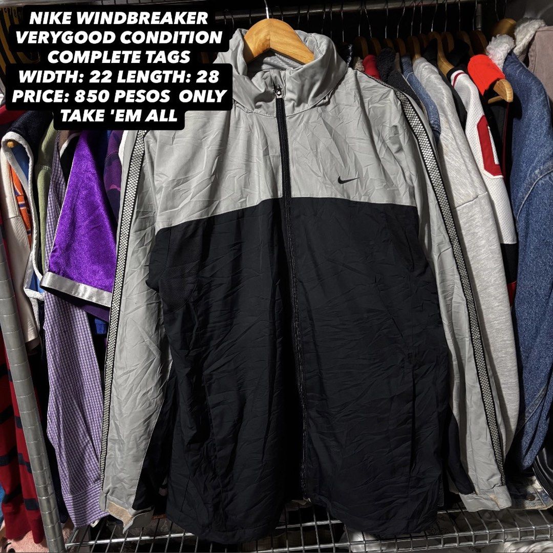 Nike Windbreaker Jacket - Grey/Black - Size L (Category: Coats, Jackets and Outerwear) located in Caloocan City. Submitted by bonsatocha43876 (Listing ID 1461981621, Image 1). Description: - Authentic Nike windbreaker jacket - Stylish two-tone grey and black design - Features the classic Nike swoosh logo - Side stripe detailing on sleeves - Full zip closure for easy wear - Tagged size Large (L) - Measurements: Width 22 inches, Length 28 inches - 